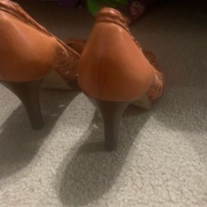 Orange high heeled shoes